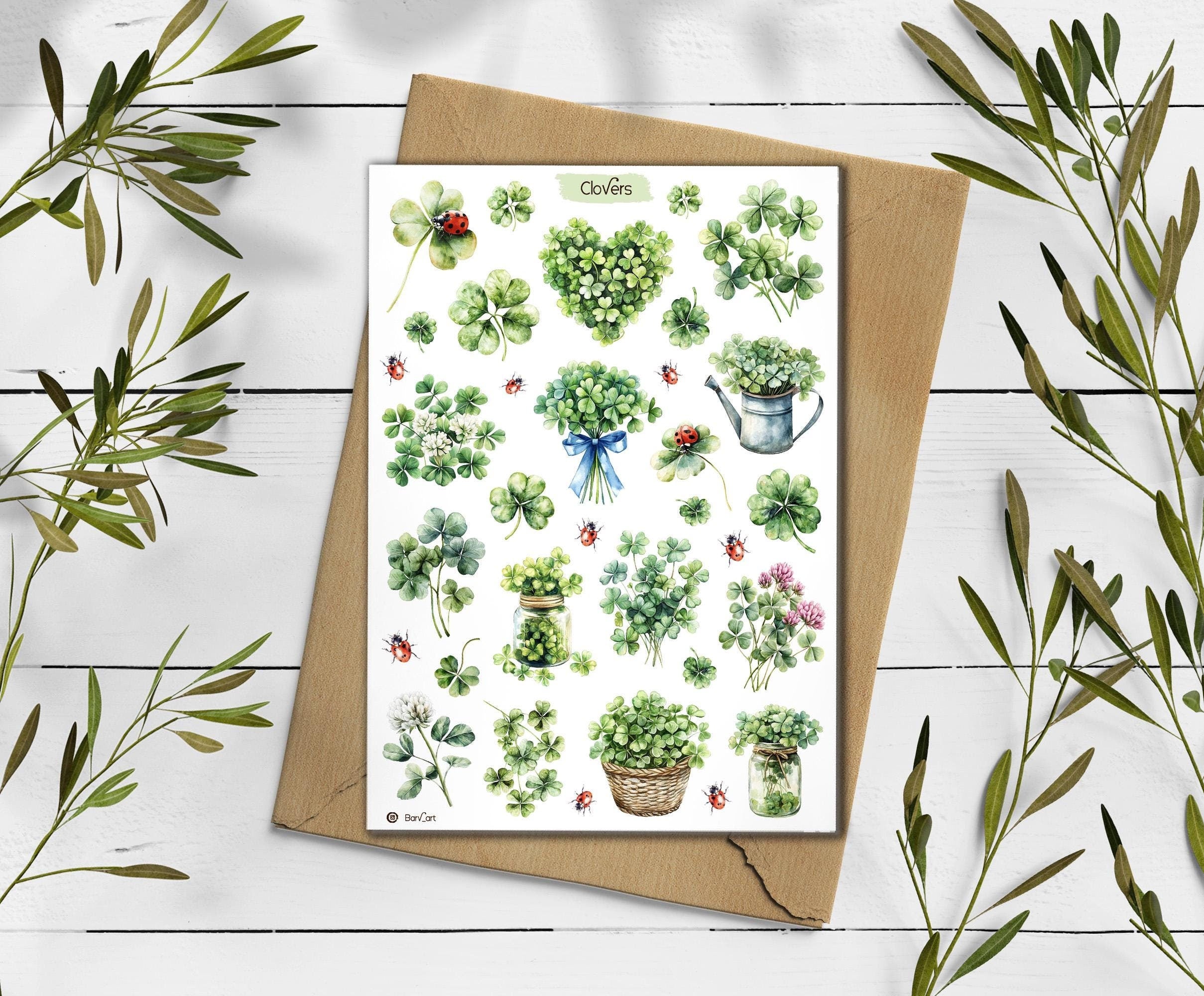 Clover sickers on a wooden surface with green leaves.